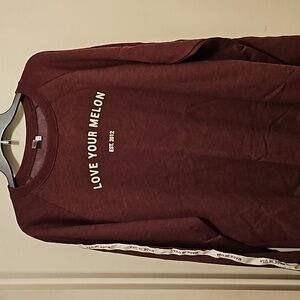 Burgundy sweat shirt. Love your melon charity.